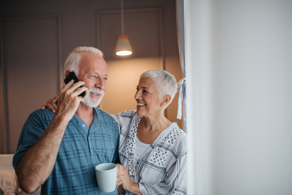 elder people using a mobile phone